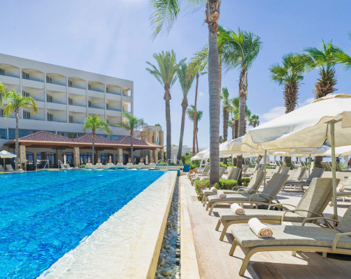 Family pool located on the beach of a blue flag beach at Alexander the Great Beach Hotel Paphos