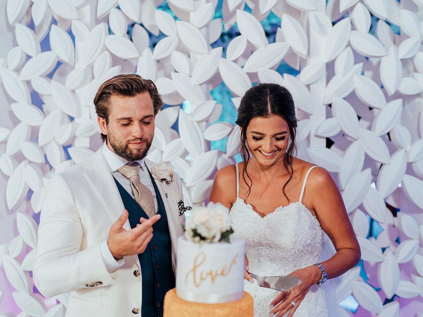 Newlywed couple cutting wedding cake at You & Me Bar at Olympic Lagoon Resorts, Ayia Napa