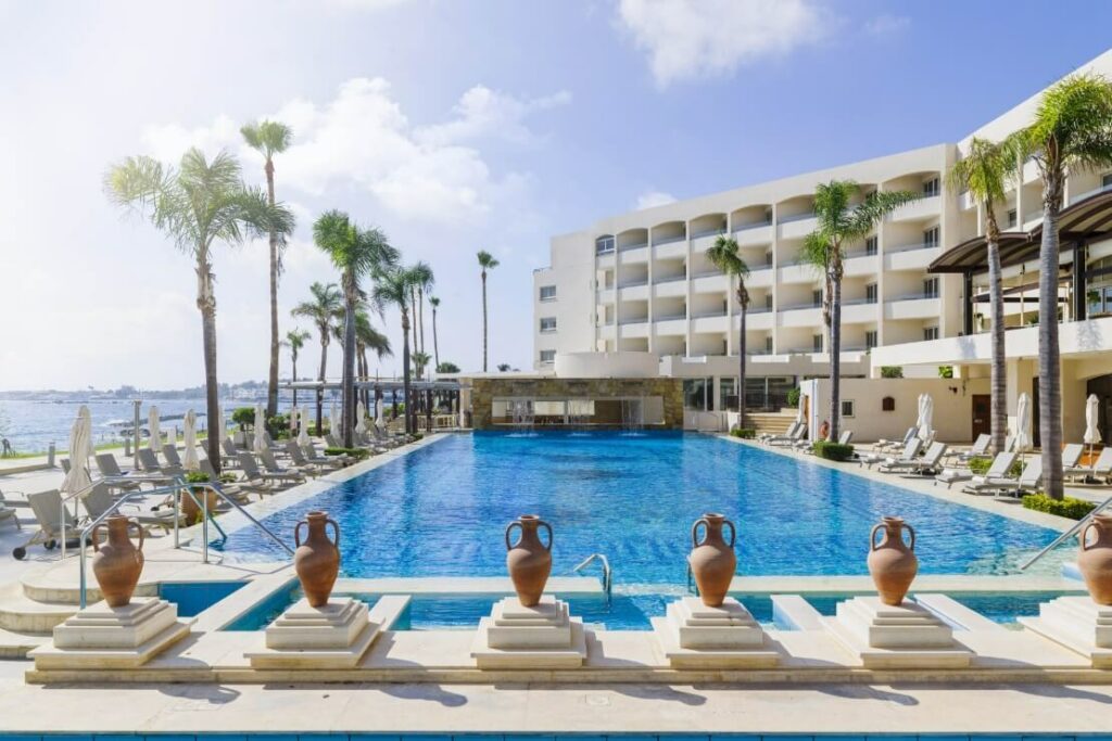 the exterior pool with seaview and direct access to the beach at the Alexander the Great Hotel in Paphos